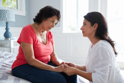 caregiver and old woman talking each other