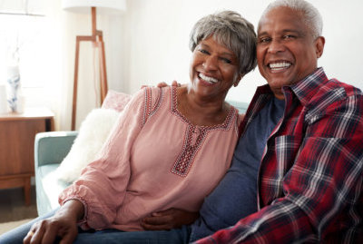 husband and wife are smiling each other